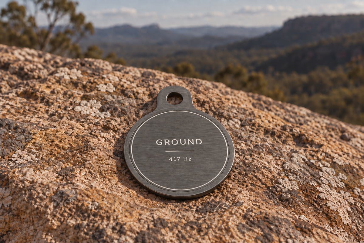 Ground pendant in brushed gunmetal, reverse engraved GROUND and 417 Hz